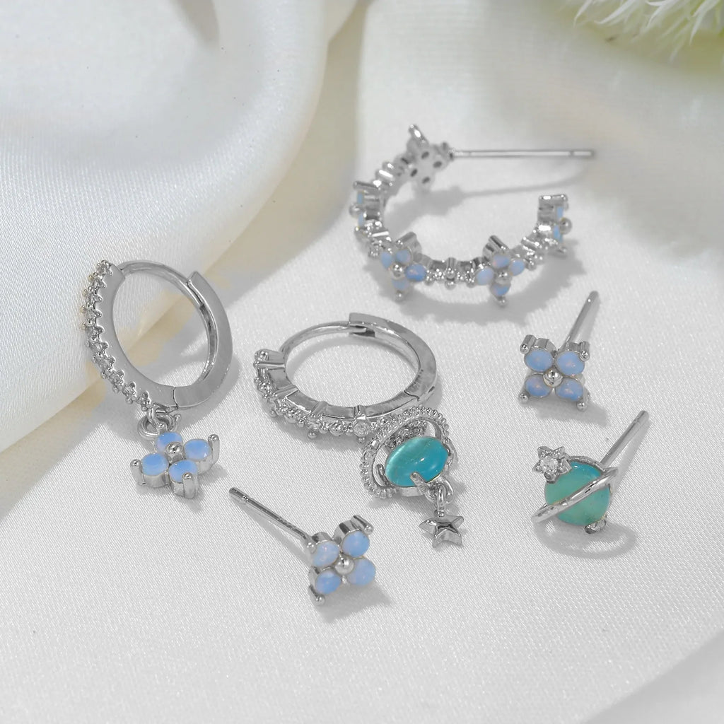 Flower-shaped ear studs with protein nail and zircon mosaic details in gold or silver Japanese Korean style