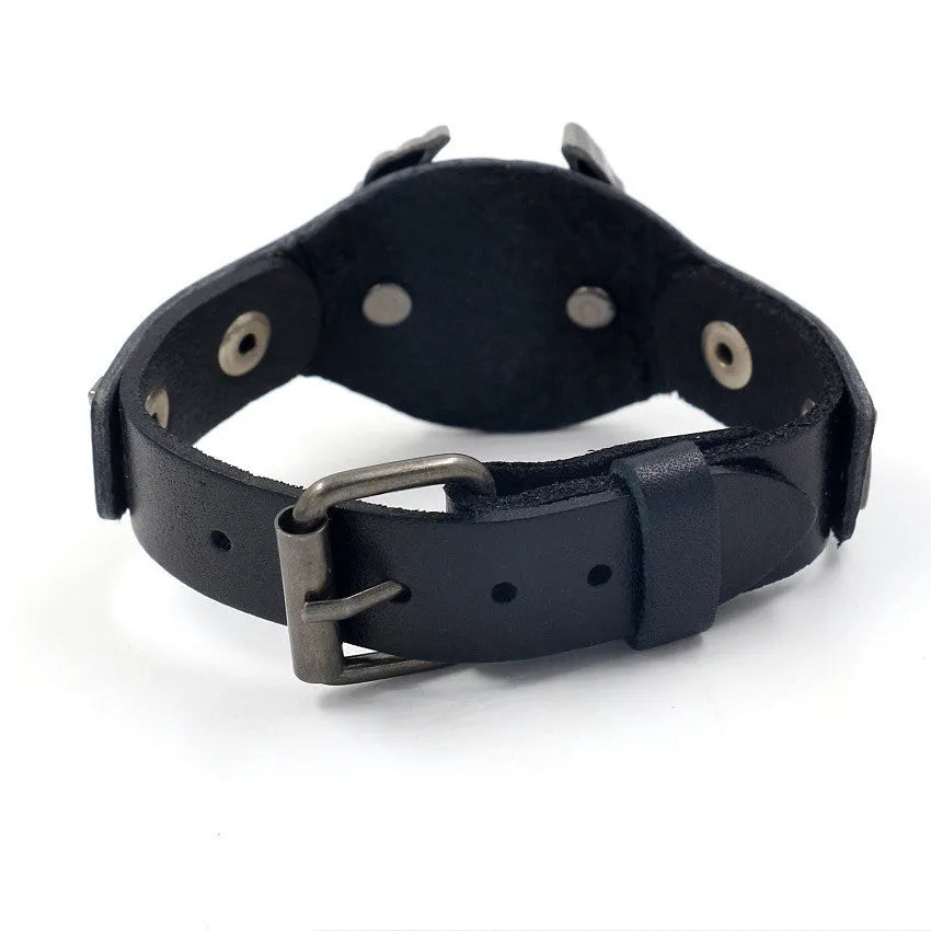 Black leather bracelet with alloy eagle watch-button clasp showing geometric patterning