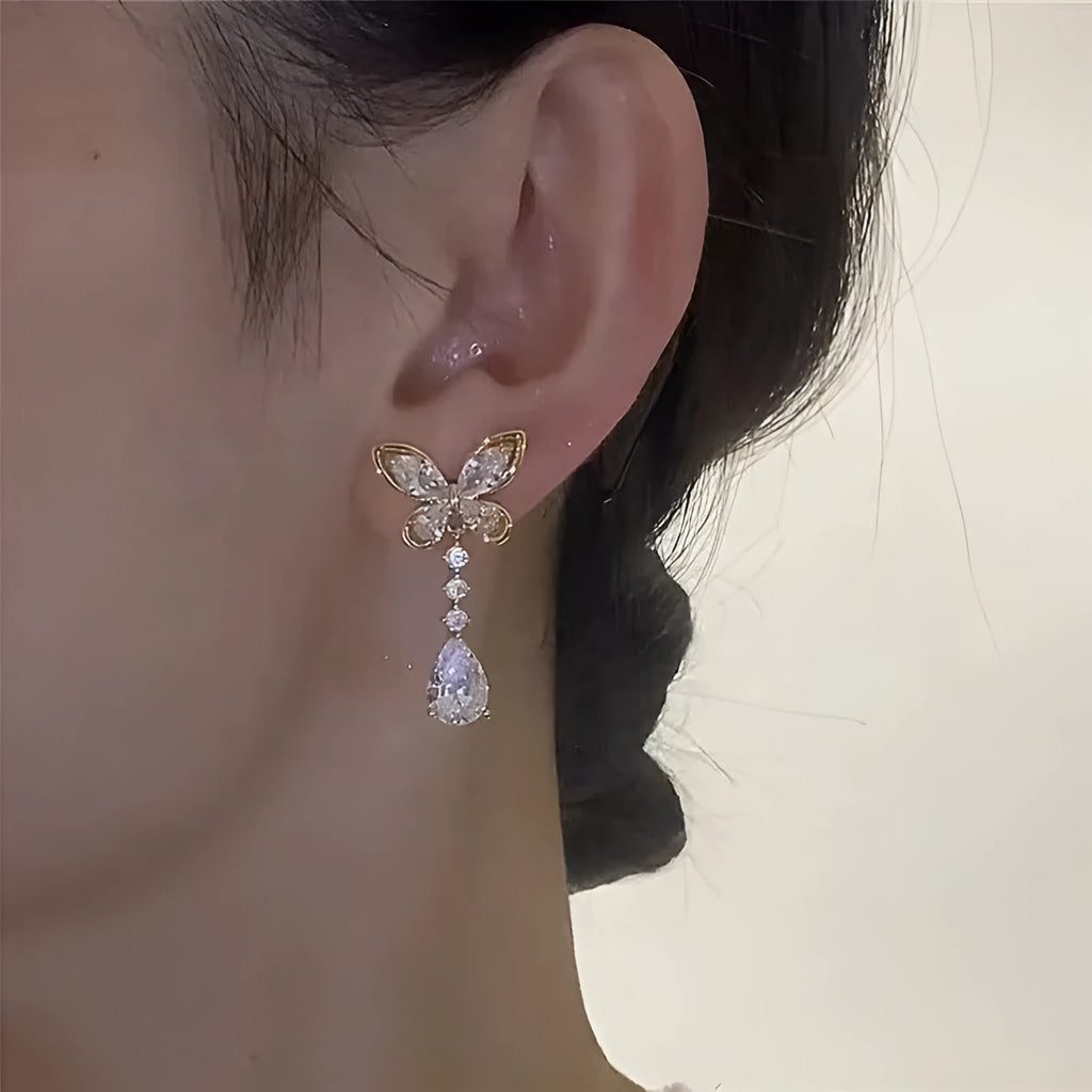 Platinum colour bow stud earrings with zinc alloy construction and electroplated finish
