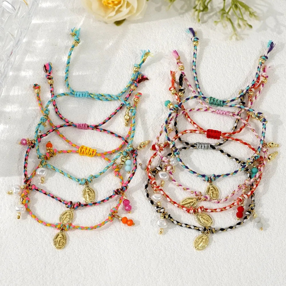 Hand-woven ethnic style bracelet made from colourful braided rope with carrying strap detail
