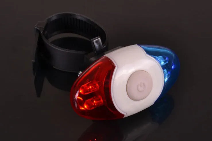 Red and blue LED tail light with adjustable mounting base shown in use.