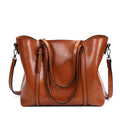 Retro messenger bag for women in PU leather with shoulder strap, showing large main compartment