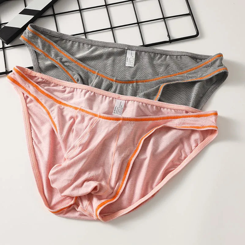Men's dark grey modal hip-lift boxer shorts laid flat, showing knitted fabric texture.