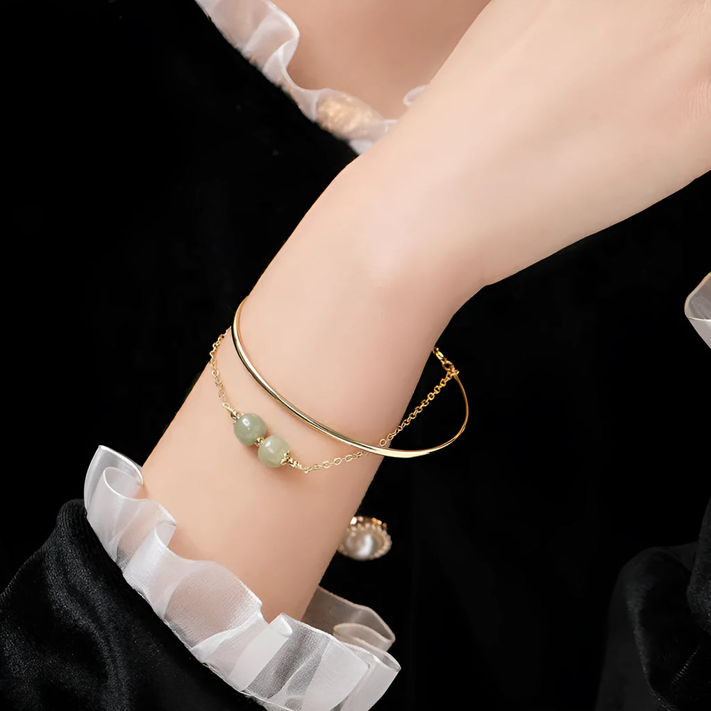 Women's jade lucky beads bracelet with gold inlay, showing single, double, and three bead version options.