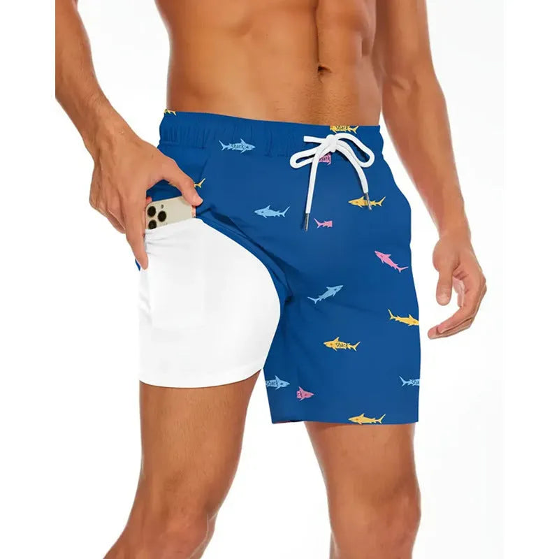 Man wearing loose grey polyester beach shorts, showing fit and style for summer leisure.