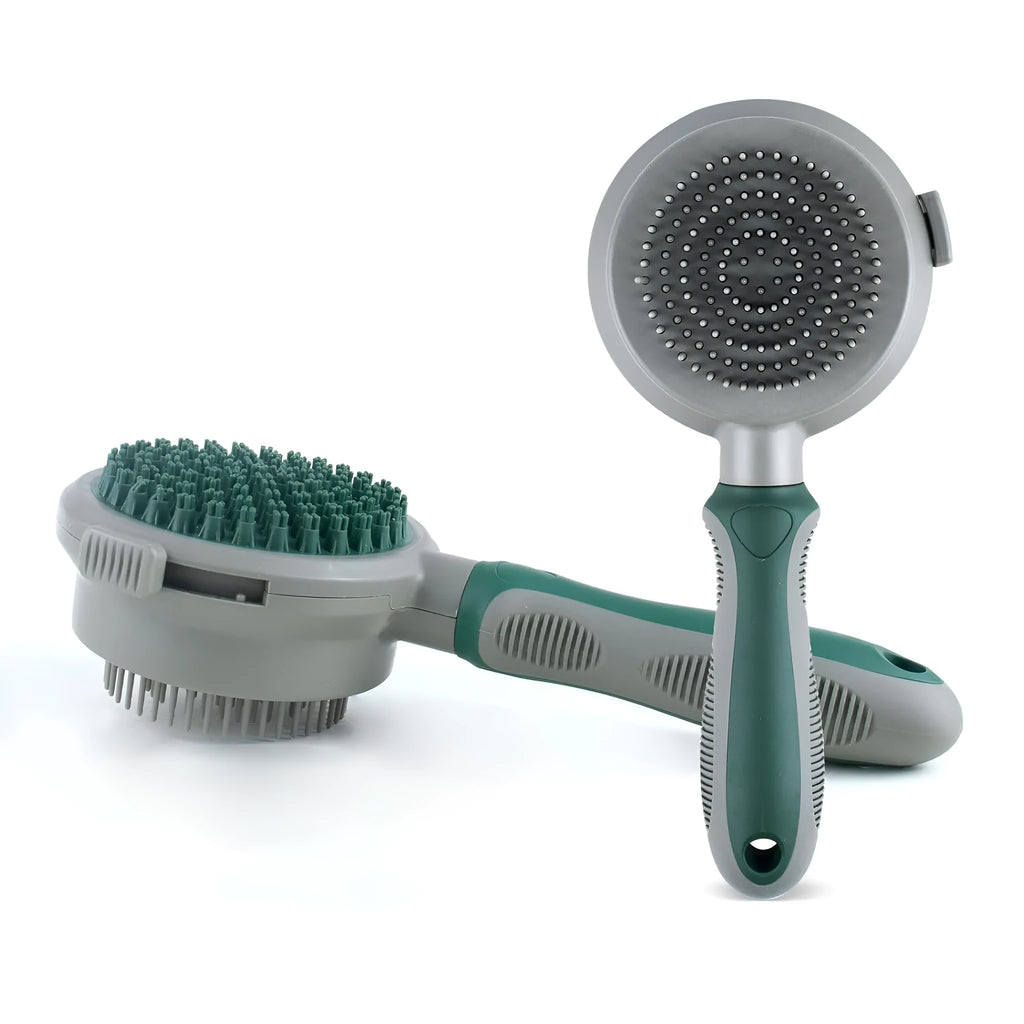 Green and pink dual-sided pet grooming brush with silicone massager and retractable slicker brush.