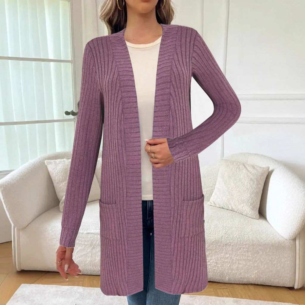 Long sleeve loose fit knitted cardigan jacket with pockets in polyester fabric.