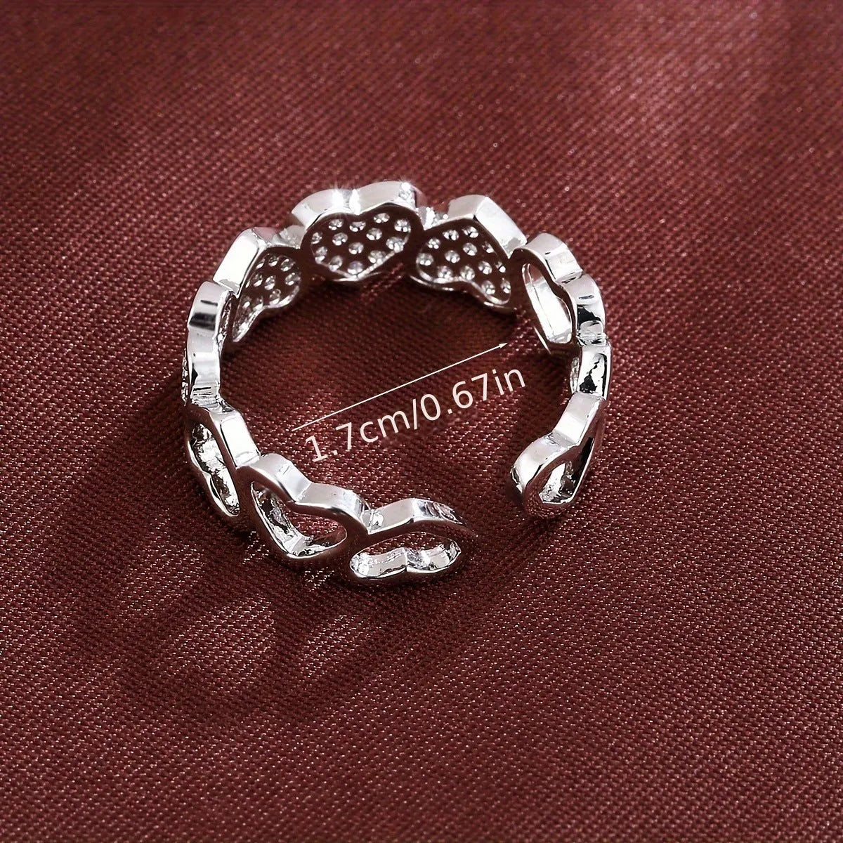 Adjustable opening couples ring with heart design in gold or silver colour on small finger