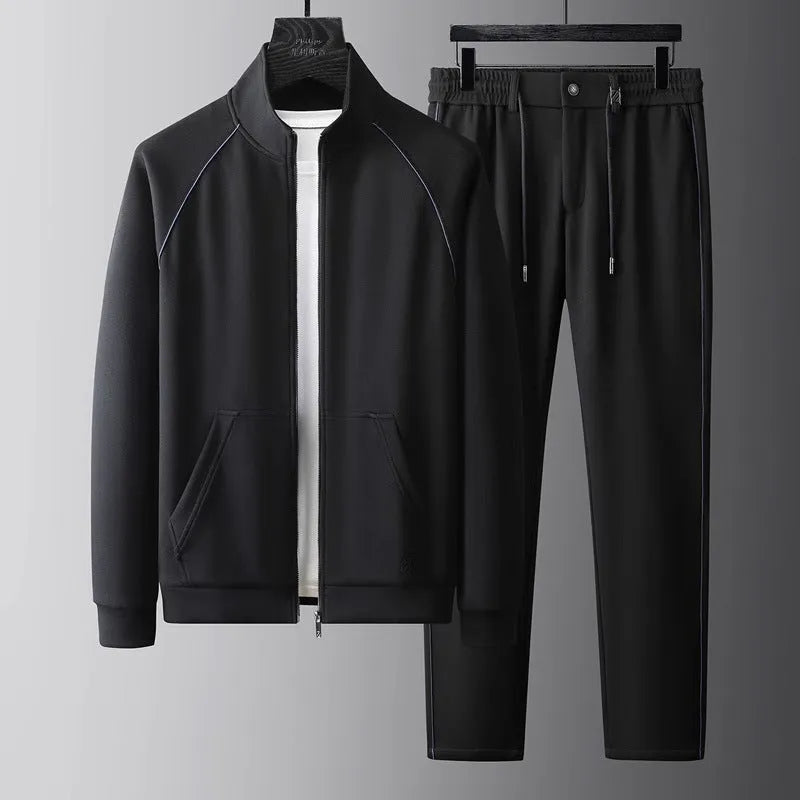 Stand collar casual sports suit comprising a coat and trousers in a slim fit, shown in coffee colour.