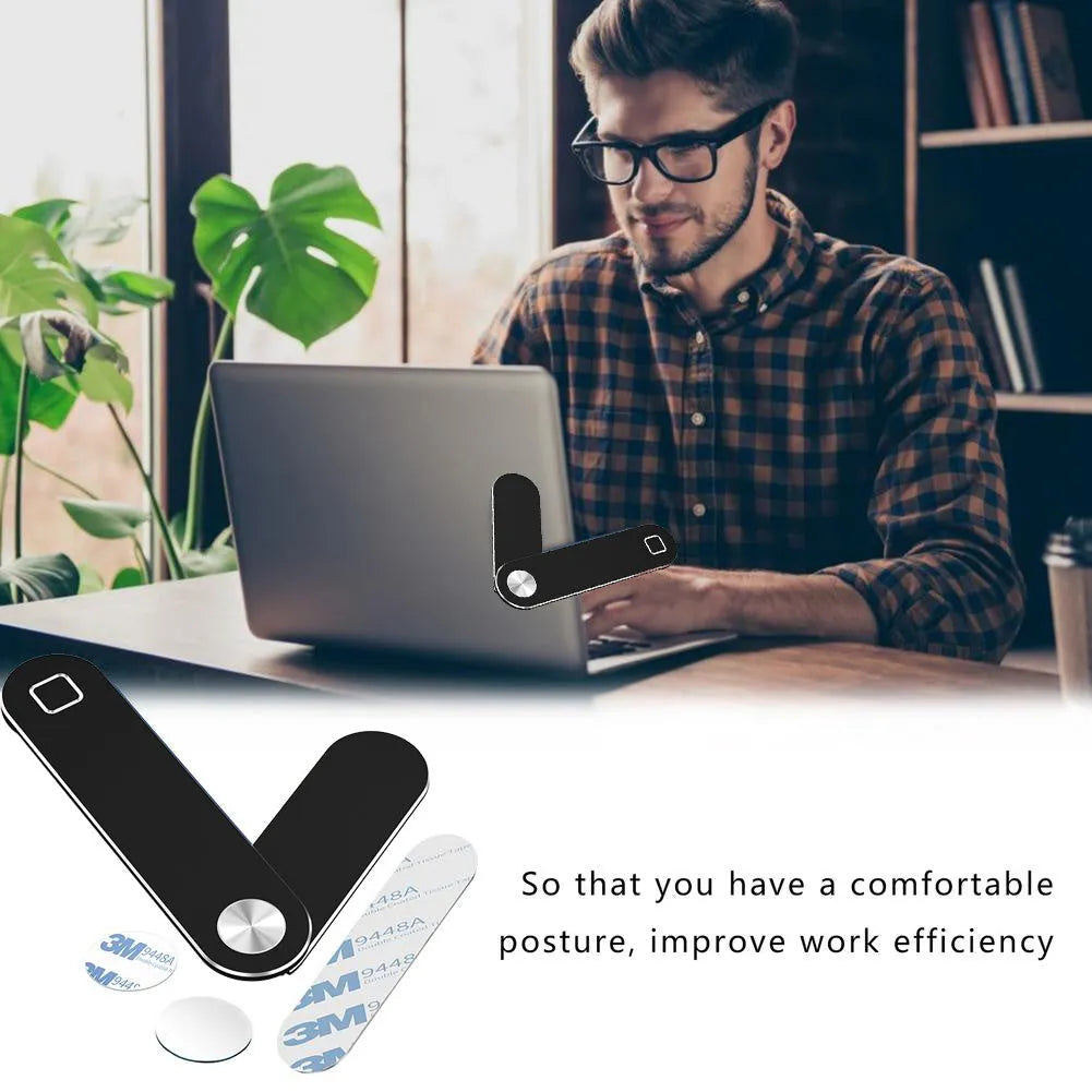Black aluminium laptop phone holder mounted on computer monitor with smartphone attached