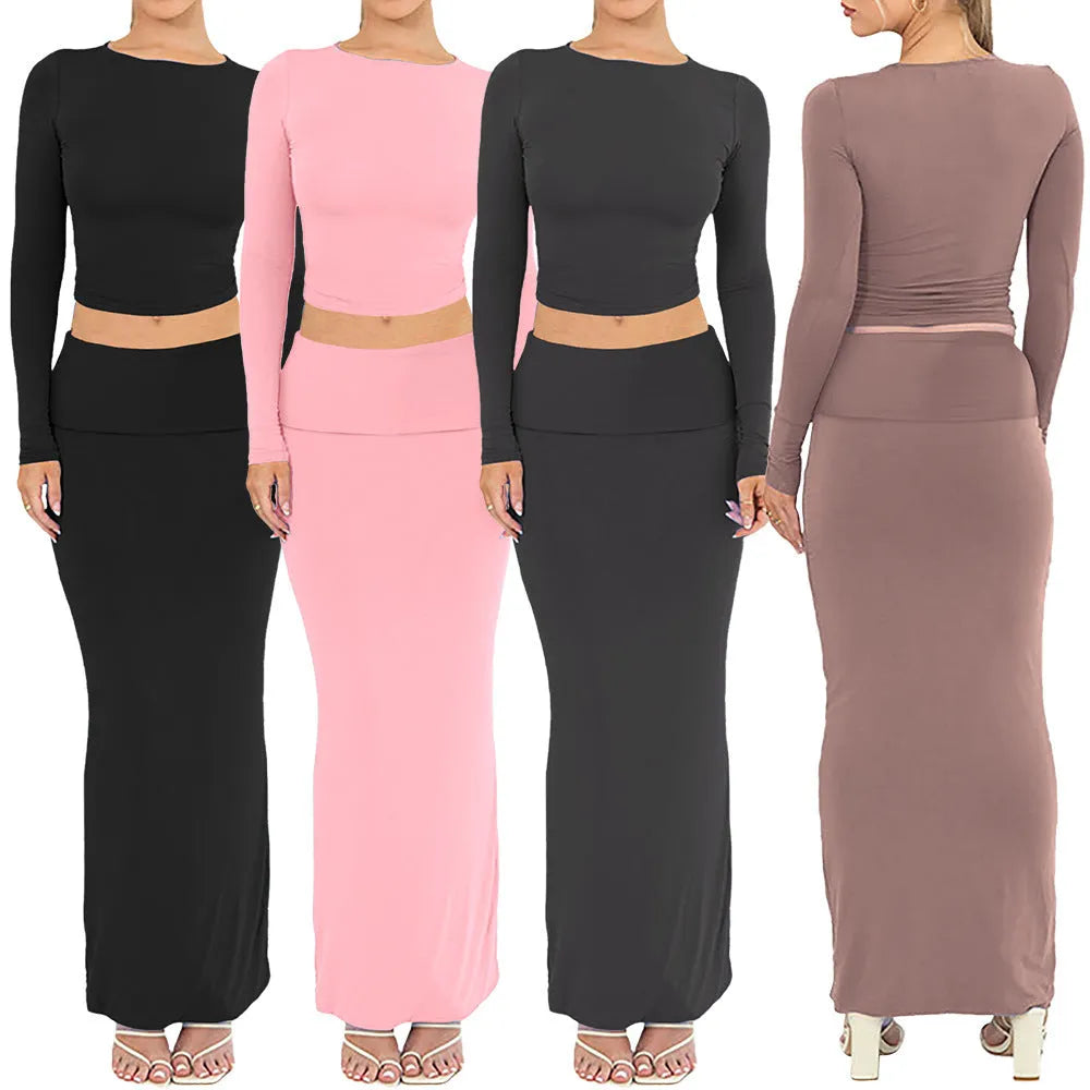 Women's black slim fit polyester two-piece suit with three-quarter sleeves and a long skirt.