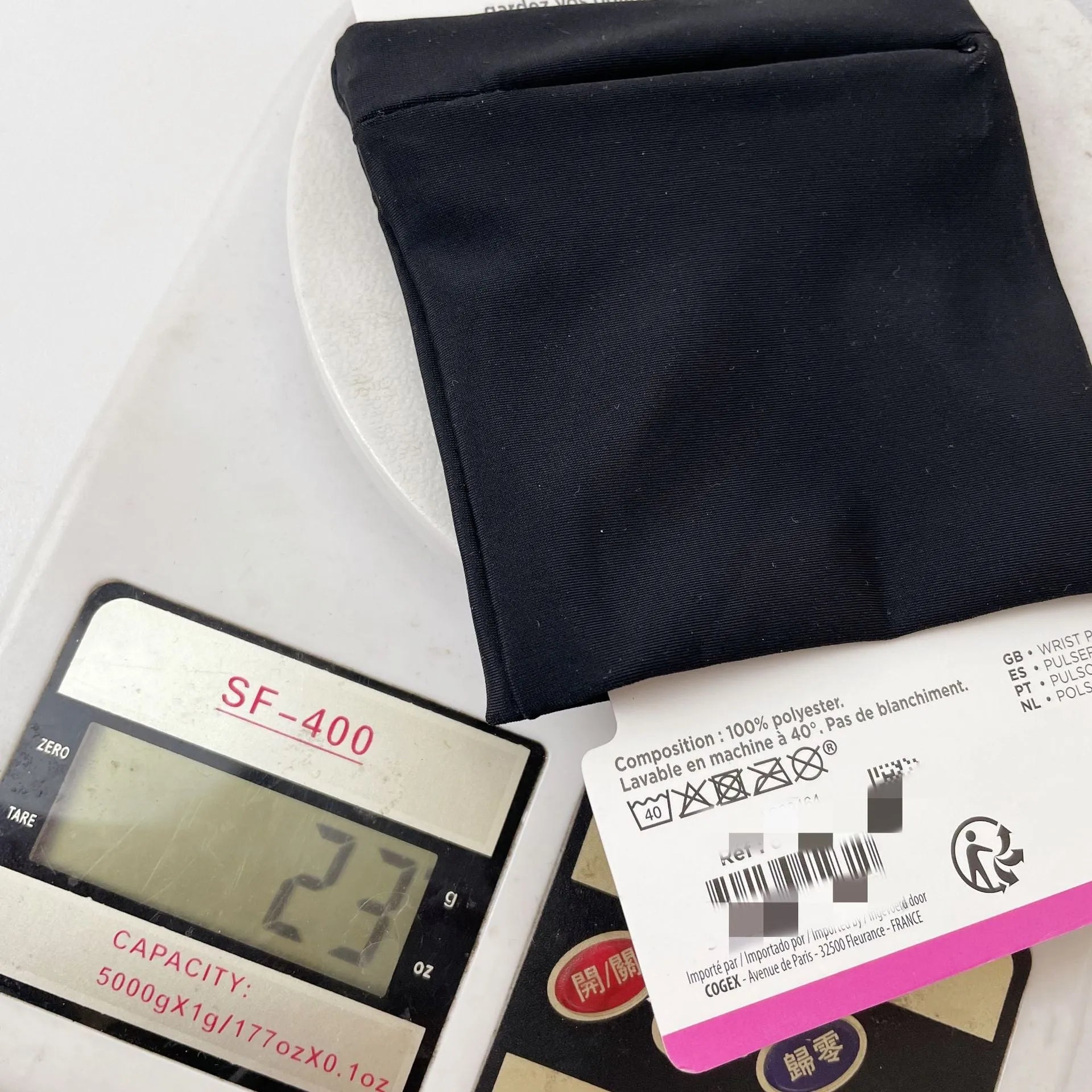Adjustable fabric armband phone holder for wrists, shown with strap and 10x10.5cm phone compartment.