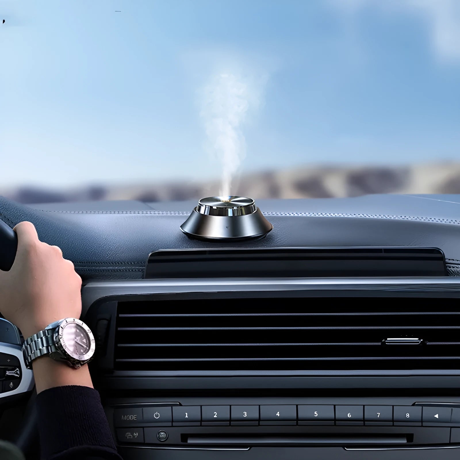 Black metal butterfly-shaped car aromatherapy diffuser with USB cable and 50ml essential oil bottle.