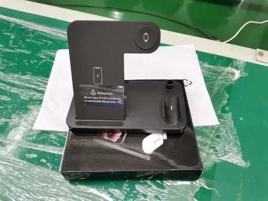 Folding 4-in-1 wireless charger in black showing vertical iPhone charging station mode with MagSafe attachment