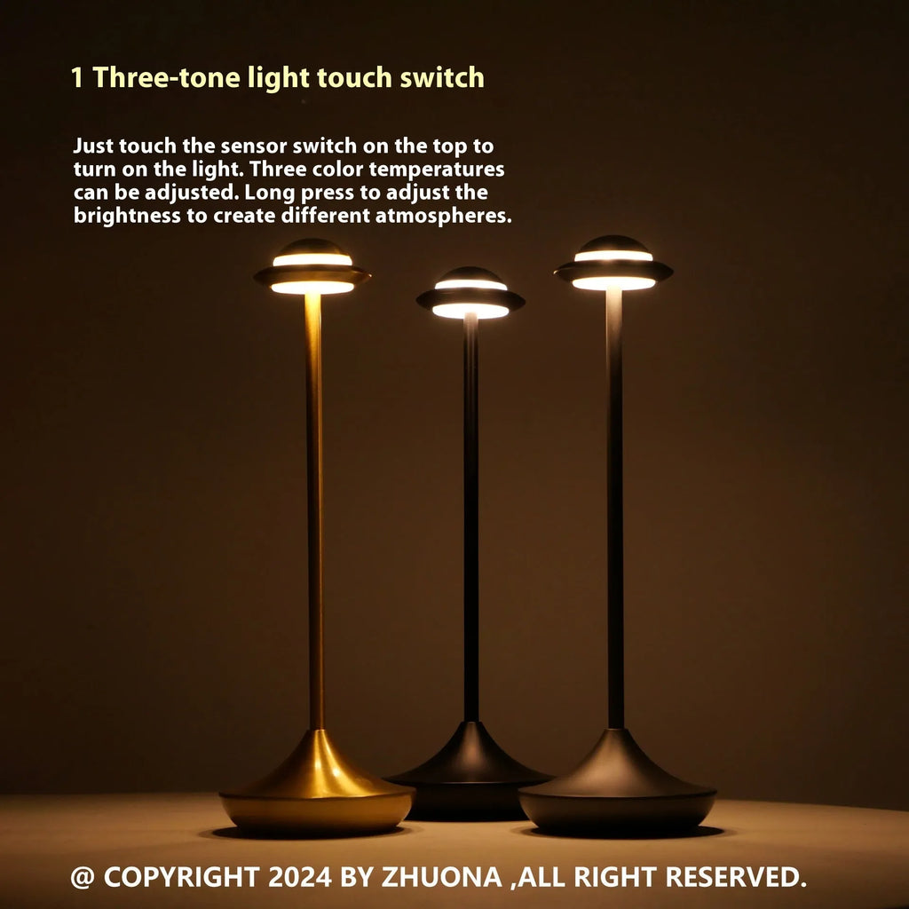 UFO-shaped table lamp with metal base and touch dimming controls in black, gold, or grey colour
