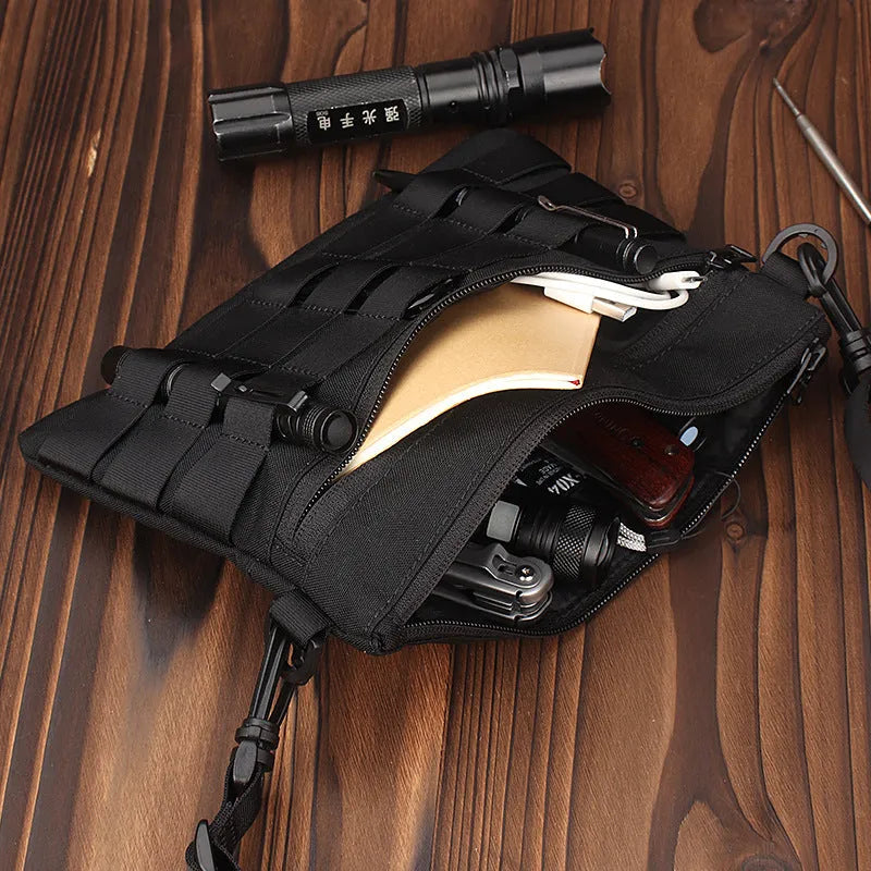 Black military-style Oxford cloth waist bag shown closed, measuring 18cm.