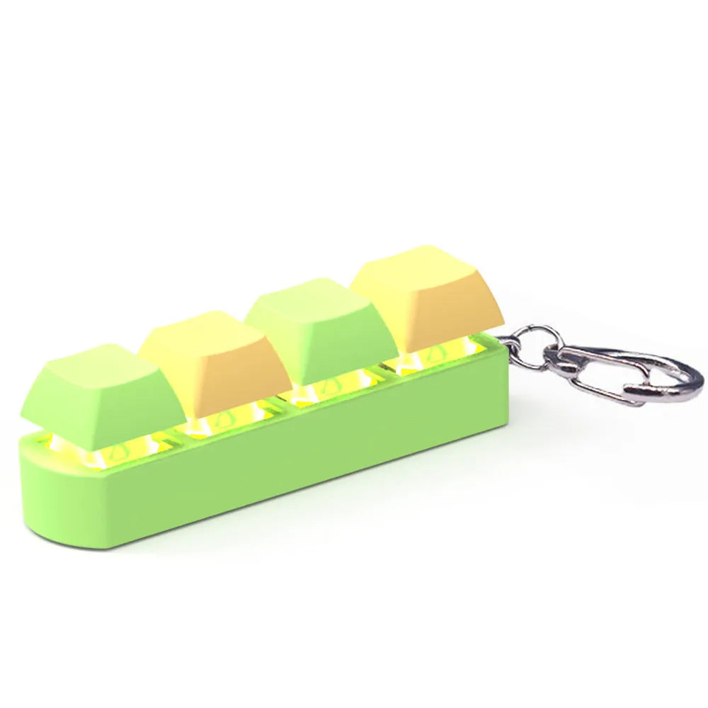 A compact mechanical keyboard switch tester with four different coloured keycaps and an included keycap puller.