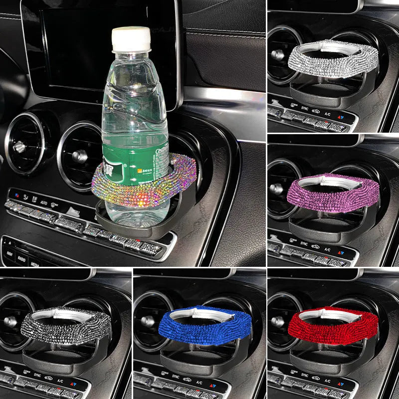 Sparkling rhinestone car cup holder bracket clipped to a vehicle air vent, shown in pink diamond colour.