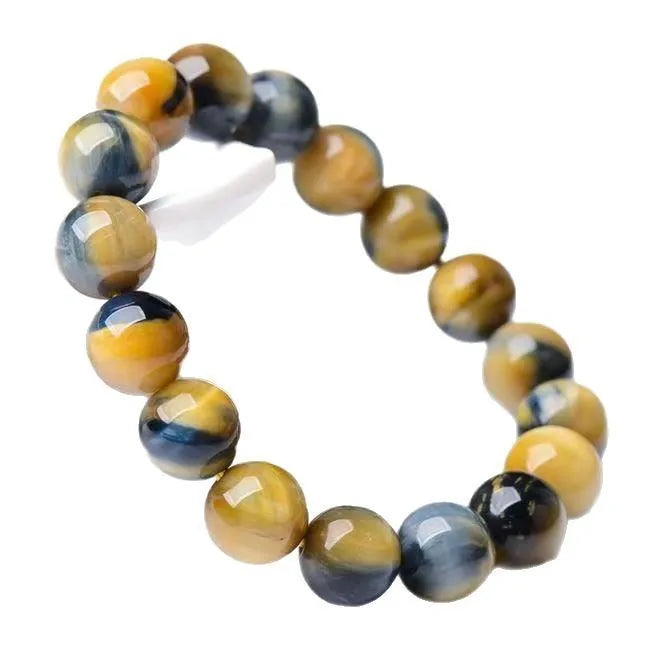 Handmade fantasy tigereye agate bracelet with round beads in a single circle, shown in natural stone colours.