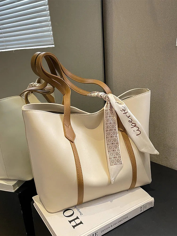 Casual tote bag with bucket fashion design in available colour combinations showing shoulder and crossbody carry options
