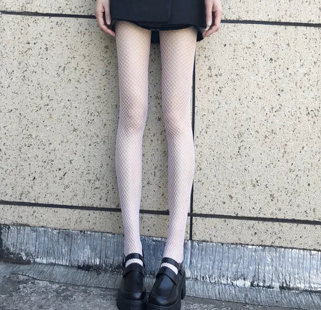 Women's summer mesh stockings showing large, medium and small net patterns in black and white colours