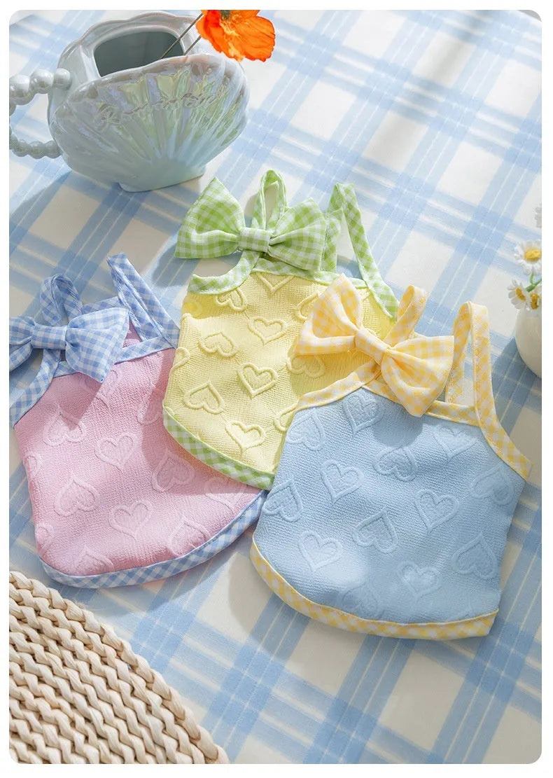 Small dog vest with heart relief texture bow suspenders in elastic polyester fabric