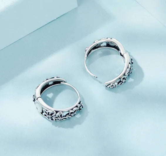 Retro hollow butterfly earrings in sterling silver with zircon accents, measuring 14mm by 5mm