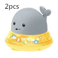 Electric whale bath toy spraying water with flashing LED lights in baby bath