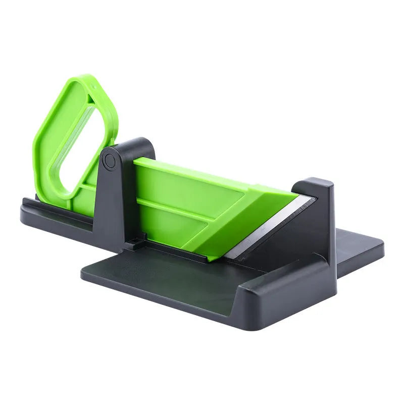 Green and red modern vegetable cutter with stainless steel blades for slicing carrots and potatoes