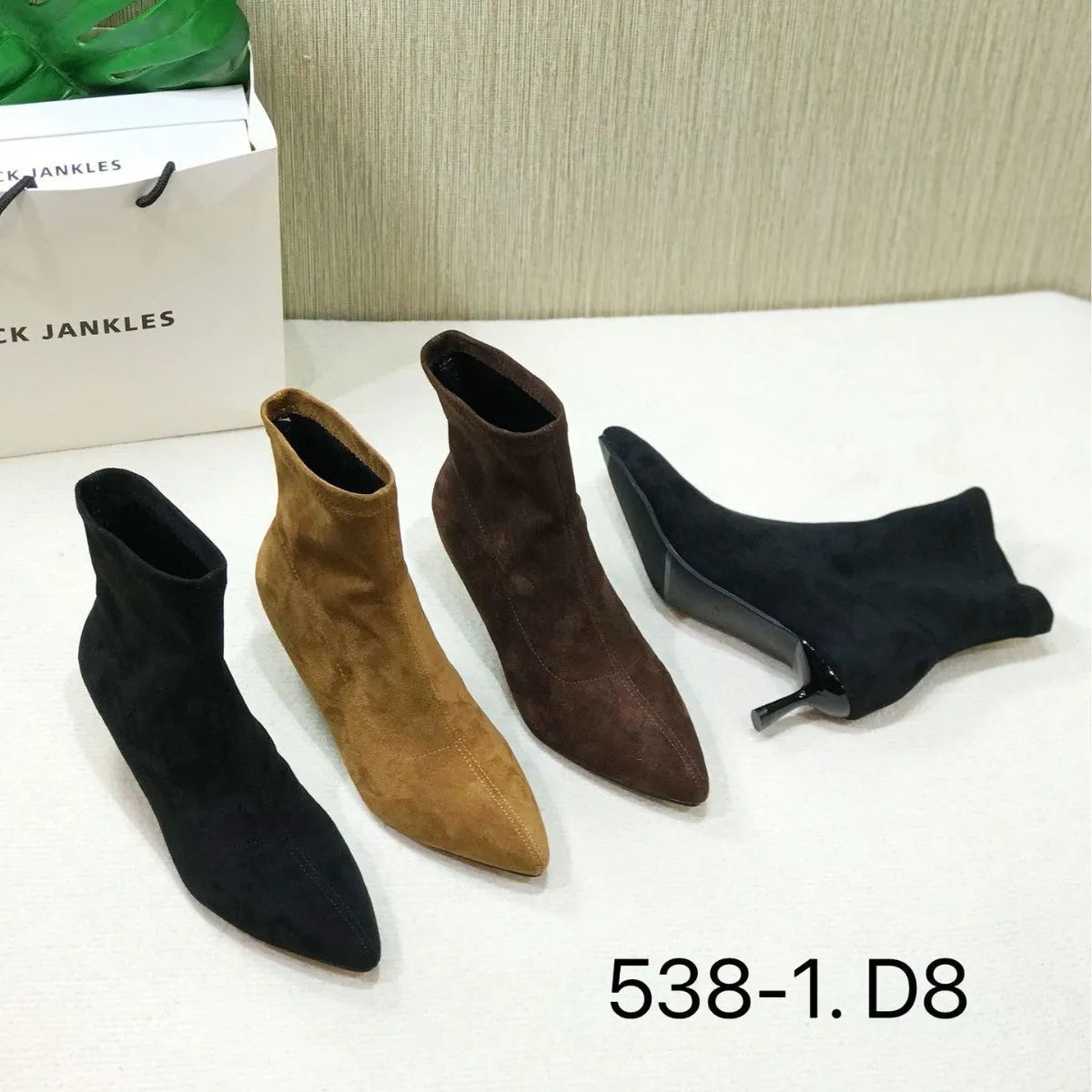 Black pointed toe stiletto heel ankle boots with microfiber upper and mid-calf length