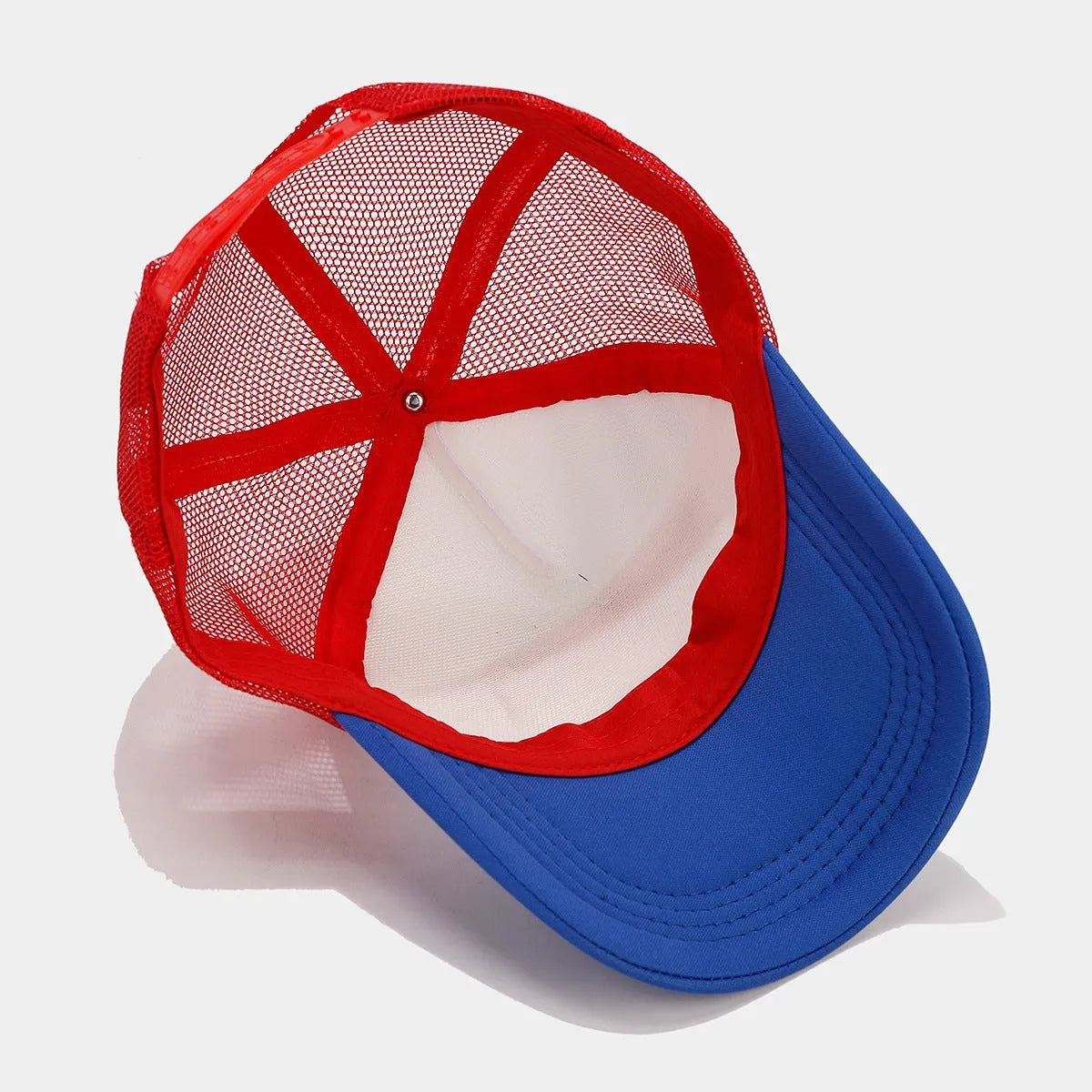 Red and blue contrast mesh baseball cap with adjustable strap on a dome crown.