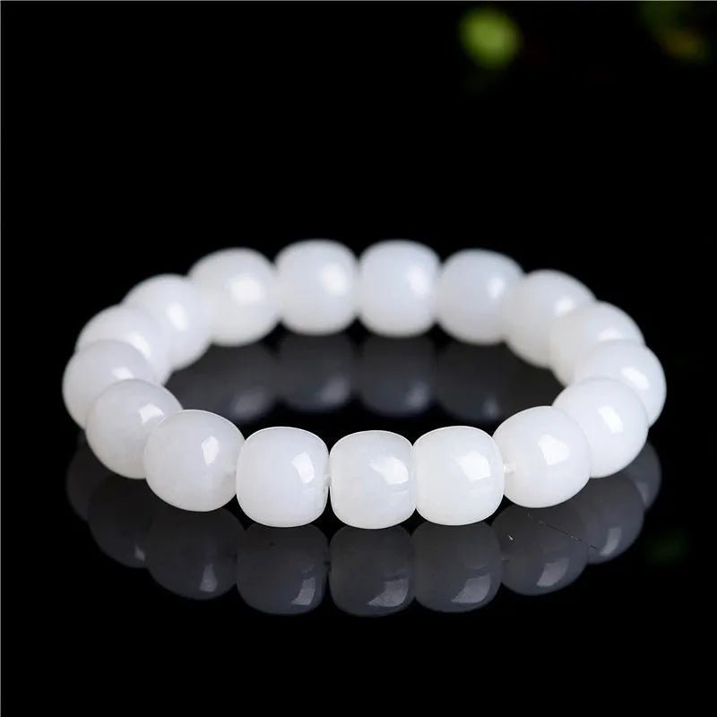 White Hetian jade barrel bead bracelet showing three size options on a neutral background
