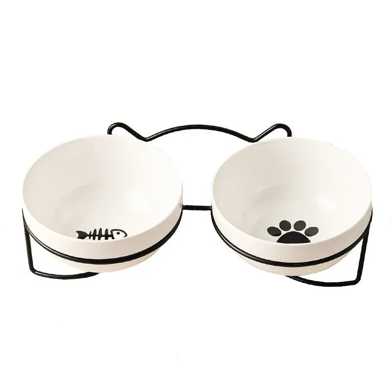 White ceramic cat bowl with cat paw design in black iron frame