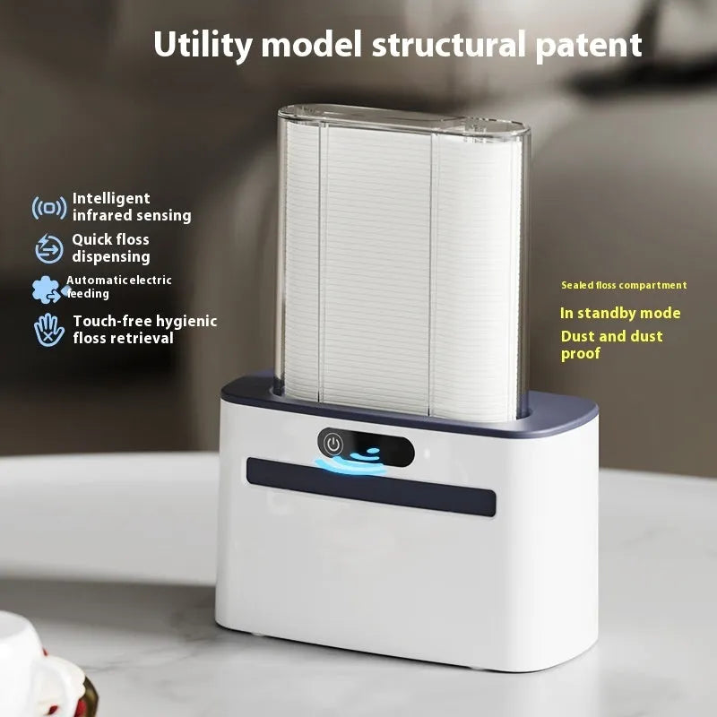 Automatic rechargeable dental floss box in dark grey, gold, and light grey colours with floss refill