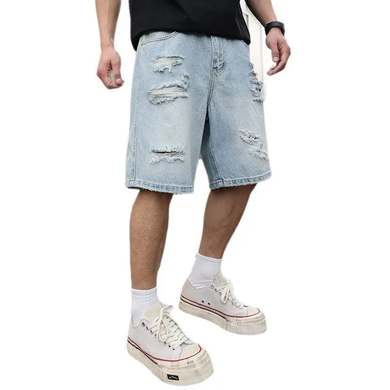 Light blue distressed denim shorts with loose straight-leg fit on mannequin