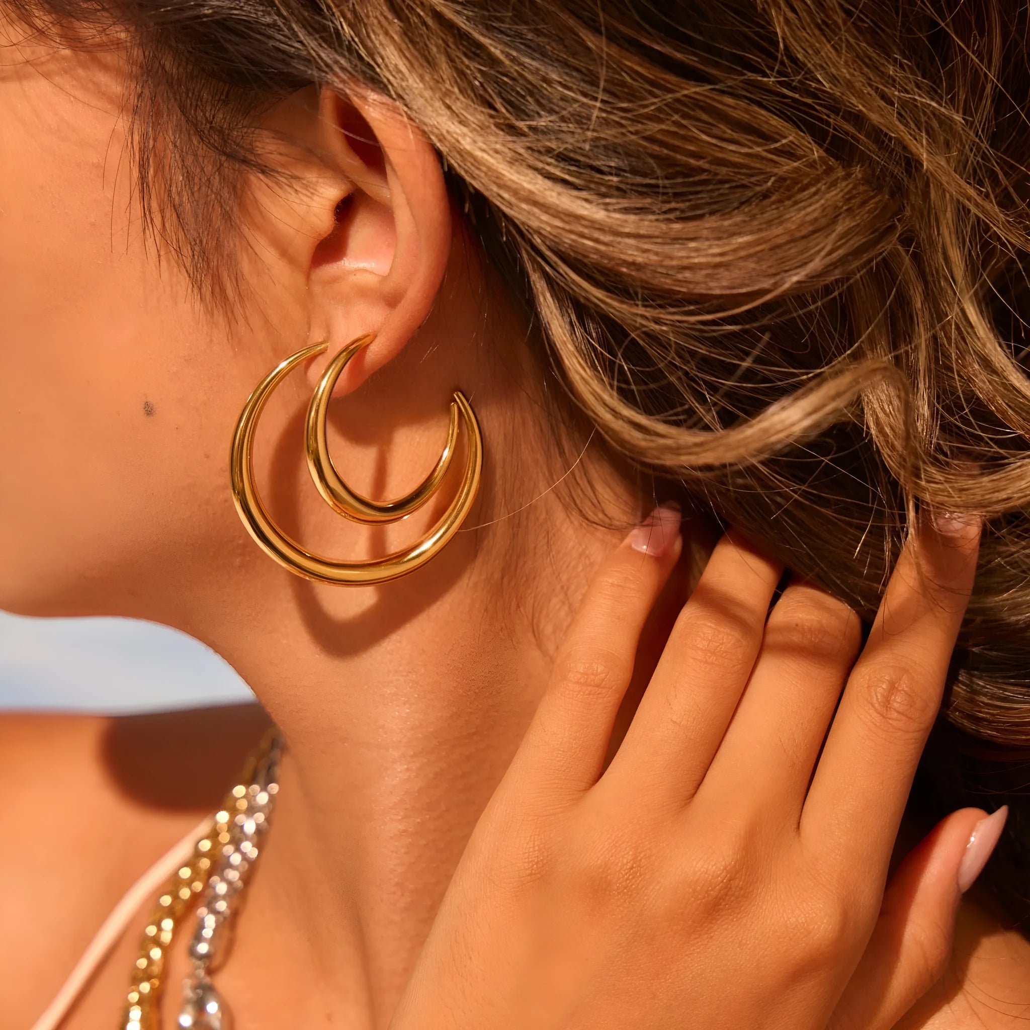 Titanium steel geometric round hoop earrings with gold plating in large and small size options