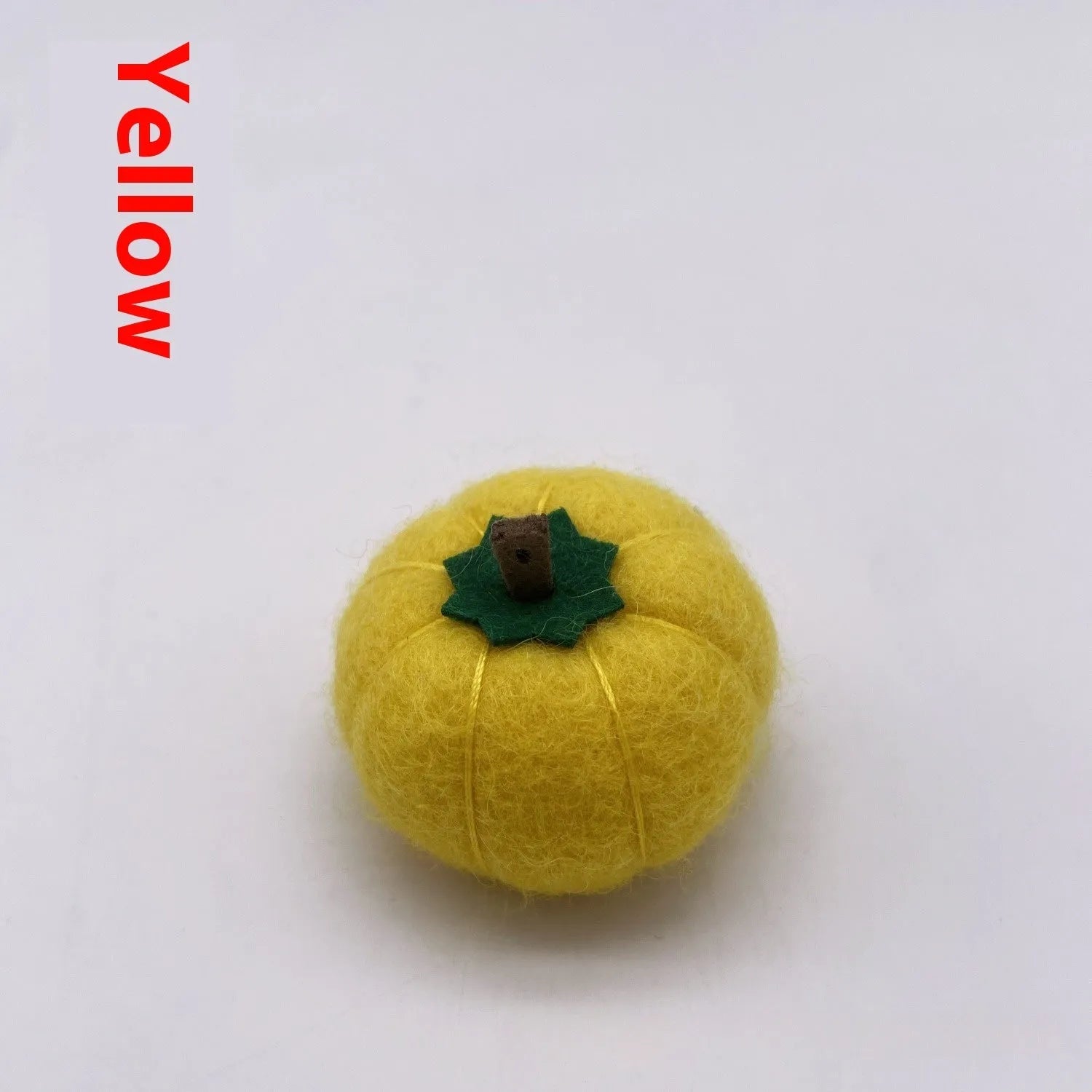 Wool felt pumpkin ornament measuring 5cm diameter in autumn colours for miniature displays