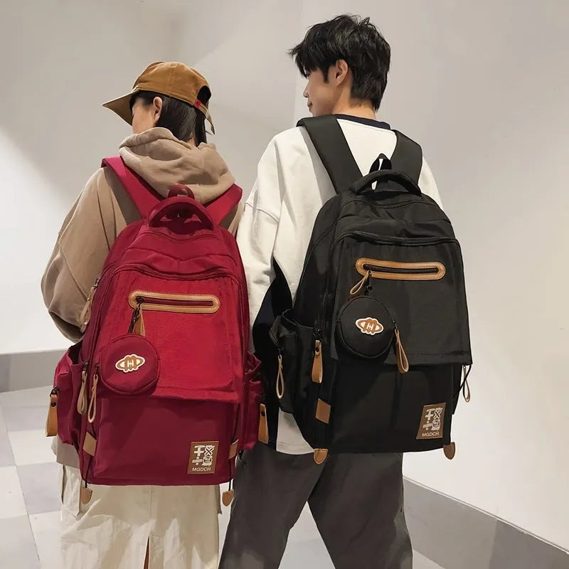 Large-capacity nylon backpack for middle school students with curved shoulder straps in multiple colour options