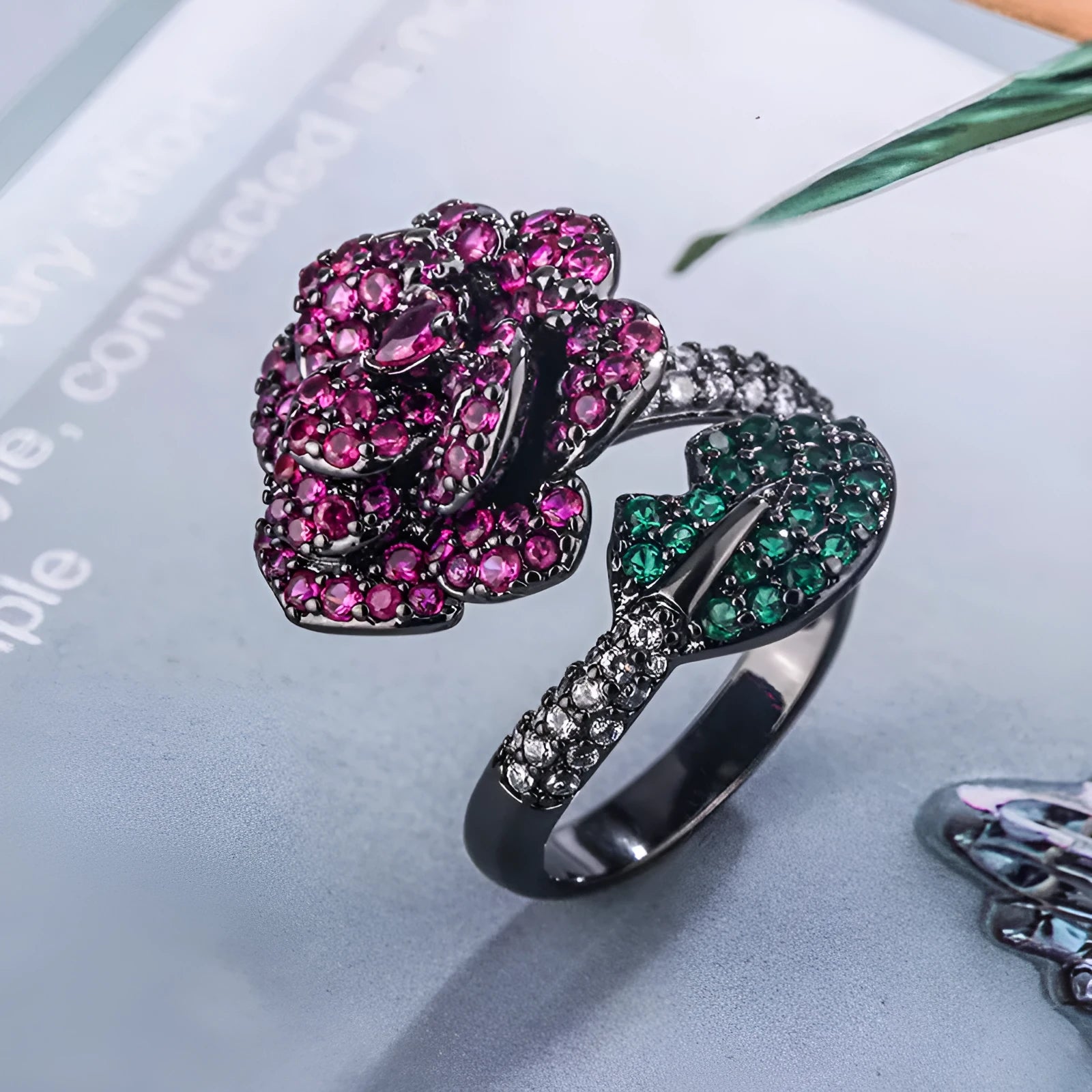 Black gold geometric flower ring with diamond-treated simulation red corundum stone