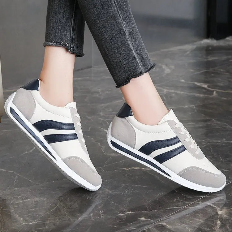 Red and blue low-top lace-up leisure sneakers with PU mesh upper and rubber sole.