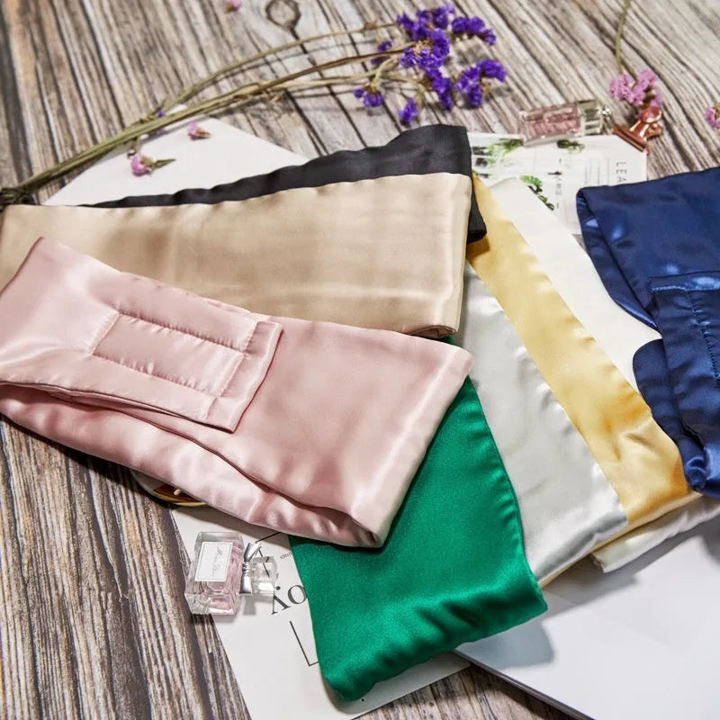 Mulberry silk sleep mask in champagne gold colour, shown folded.