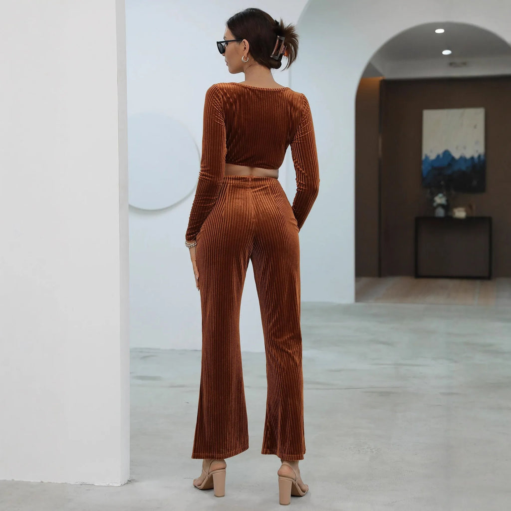 Caramel coloured women's long sleeve sweater set with matching trousers on a hanger.