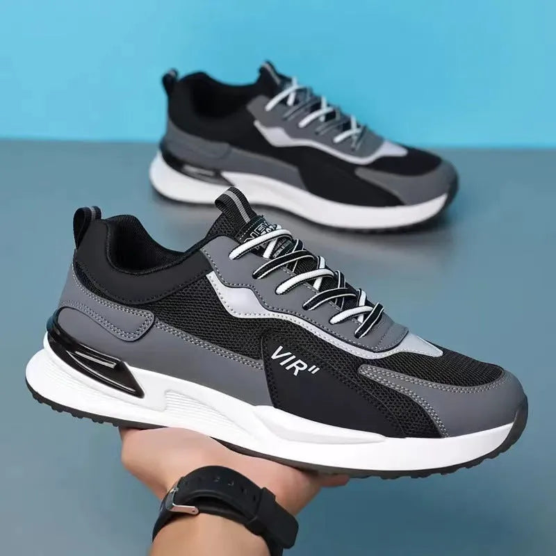 Men's colour block lace-up sneakers in grey with mesh upper and white sole.