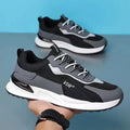 Men's colour block lace-up sneakers in grey with mesh upper and white sole.