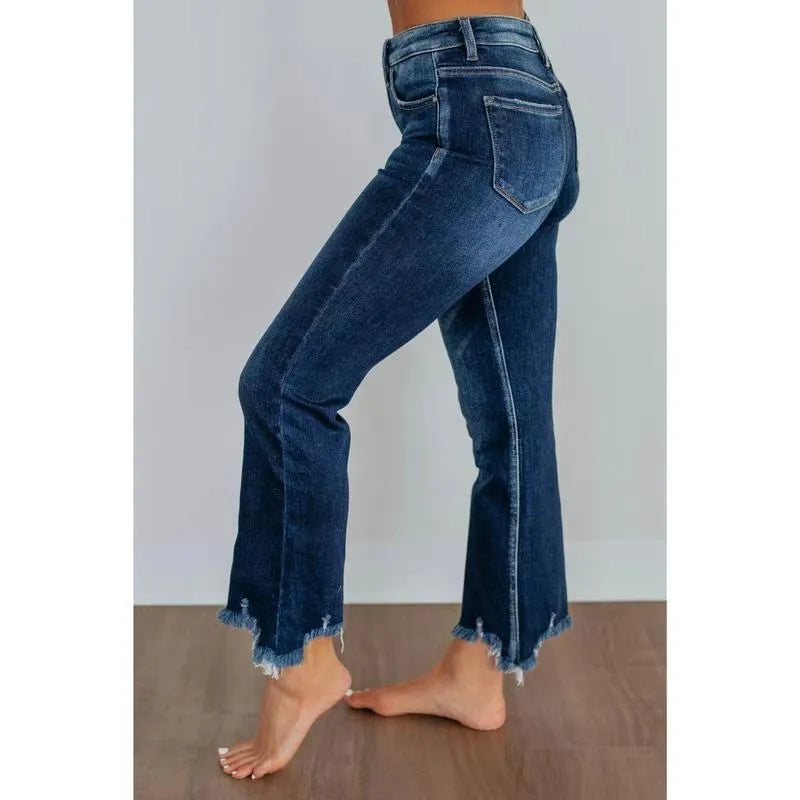 Women's solid colour denim jeans with a hand-worn finish in dark blue and light blue options.