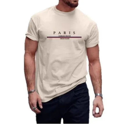 Man wearing a loose-fit, short-sleeved, grey T-shirt with a white letter print design on the chest.