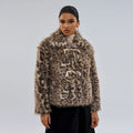 Female leopard print coat with a silver buckle detail on the lapel.