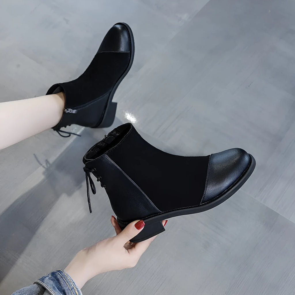 Women's black soft leather Martin boots with side zip and round toe design