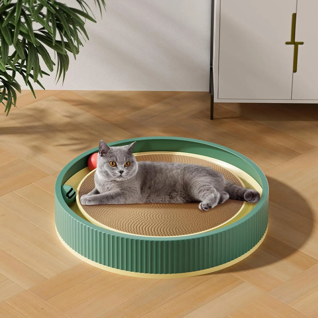 Large circular green and white cat scratching board with bell balls and a refillable cardboard core.