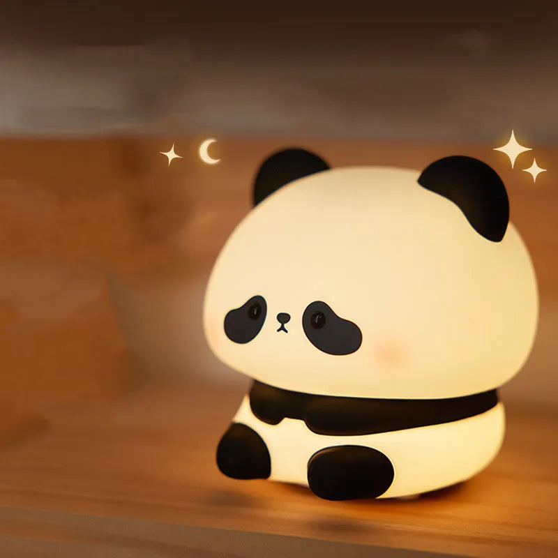 Panda-shaped night light with warm white LED glow and silicone construction